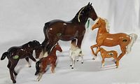 Group view of six Beswick porcelain horse figurines showing relative sizes and colors