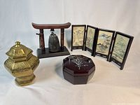 Group shot showing brass jar, bronze bell on stand, lacquer box, and four-panel screen