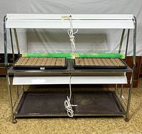 Front view of chrome rack with lights and trays assembled