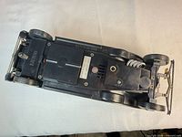 Underside view of Duesenberg car lighter showing base details and wheels