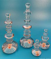 Four Holmegaard clear blown glass sculptures grouped