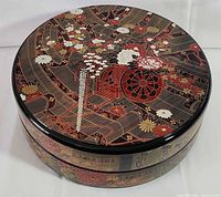 Closed jubako showing side floral pattern and lid