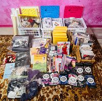 Overall lot showing pattern kits, fabric rolls, trims, notions, magazines