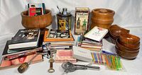 Full lot overview with books, teak ware, bar tools, boxed items