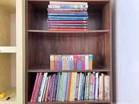 Overall view of bookcase showing all cookbooks and MusicCooks sets