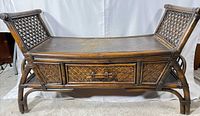 front view of rattan wood bench showing drawer