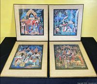 Front view of all four framed prints standing upright