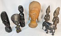 Front group view of all seven wooden figures