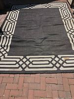 Full view of carpet laid flat showing size and border pattern