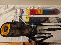 Hydration backpack with hose and two packaged kites