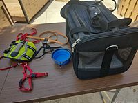 Sherpa carrier with harnesses, life jacket, leash, bowl