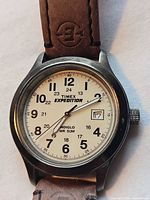 Dial close-up showing brand, model, Indiglo feature and date window