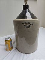 Front view showing crown 3 GAL stamp and scale can