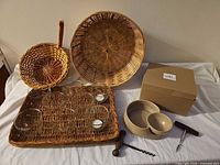 All items grouped: baskets, tray with glass votives, chip & dip bowls, corkscrews, box