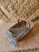 Basket filled with metal plant stakes