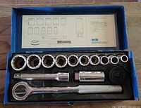 open case showing sockets, ratchet, extension, spark plug socket, drive spinner