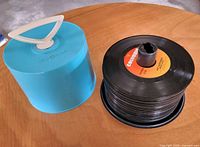 Open Disk-Go-Case next to spindle of 45 RPM records