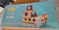 Front of box showing Mondo Llama color-your-own pirate ship kit illustration