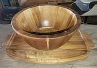 Acacia salad bowl nested on matching tray