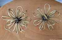 both gold metal loop sculptures top view