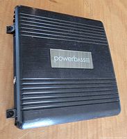 Top view showing PowerBass logo and ribbed casing