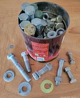 Coffee can filled with bolts, nuts and washers