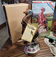 Full view of ceramic decanter with hang tag and box