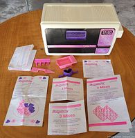 Front view of Easy-Bake oven showing keypad and accessories arranged