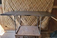 Table open showing full top and legs