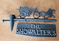 Full view of sign assembly with carriage topper and name panel