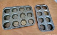 Both Ekco Ovenex muffin pans side by side showing cup designs