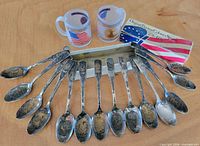 Full set of 13 spoons, two Denver Mint glass mugs, and spoon set box