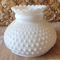 Side view showing full hobnail body and ruffled top edge