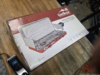 Front of sealed box showing Camp Chef Teton stove graphics