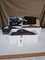 Overall lot showing four shoe boxes and pairs