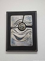 Full view of framed relief artwork