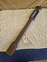 Full view of oak stick barometer on towel