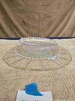 Side view showing one plate stacked with small serving bowl