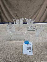 All seven cut glass items displayed together