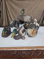 Group of all ten decoys on table