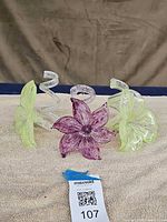 Three glass flower figurines grouped together