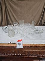 Group shot of all clear glass items on table