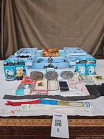 Front view of entire lot displaying organizer, packaged accessories and jewellery