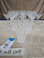 Front view of assorted cut crystal glasses arranged on towel