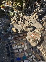 Pile of driftwood and rocks in outdoor setting