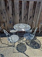 Full patio set showing table and four chairs
