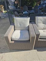 Front view of wicker armchair with cushions