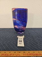 Full view of vase standing upright on surface