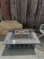 Top view showing full fire pit, tile border, mesh spark guard