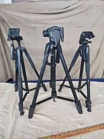 Five tripods standing extended